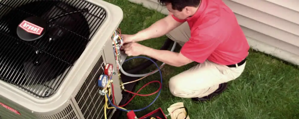 HVAC technician servicing an outdoor air conditioner unit in Mountain View, CA