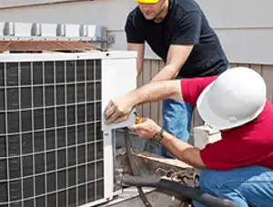 HVAC technicians repairing an outdoor AC unit on a rooftop in Mountain View, CA